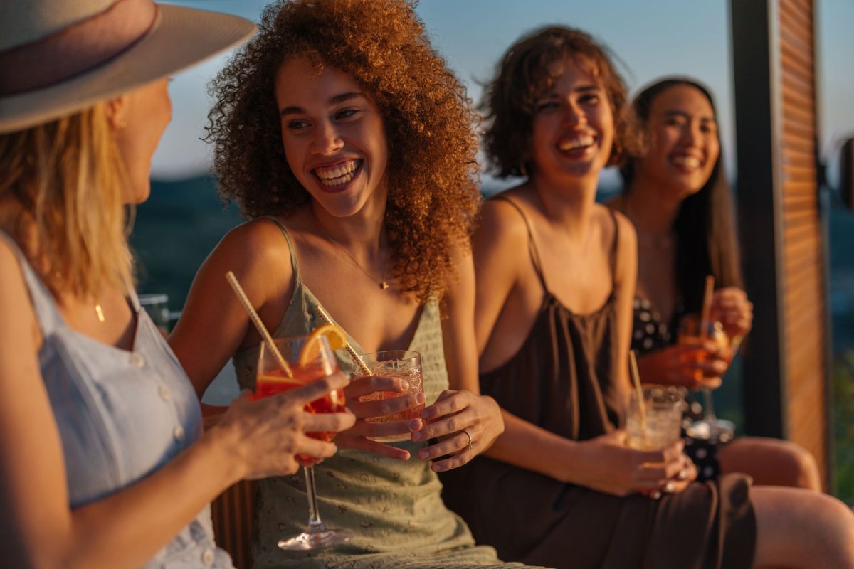 shutterstock_2737124369 | Southern Grace Stays group of women drinking